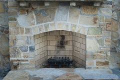 Quartzite fireplace and sandstone mantle