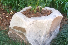 Sandstone boulder carved as planter