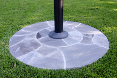 Mortared stone flagpole base