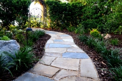 Flagstone path to backyard gate