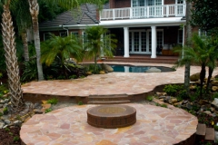 Backyard pool deck and firepit area