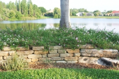 Dry-stack, tumbled stone retaining wall