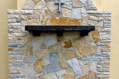 Quartzite wall with granite cross