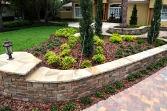 Natural and cultured stone retaining wall